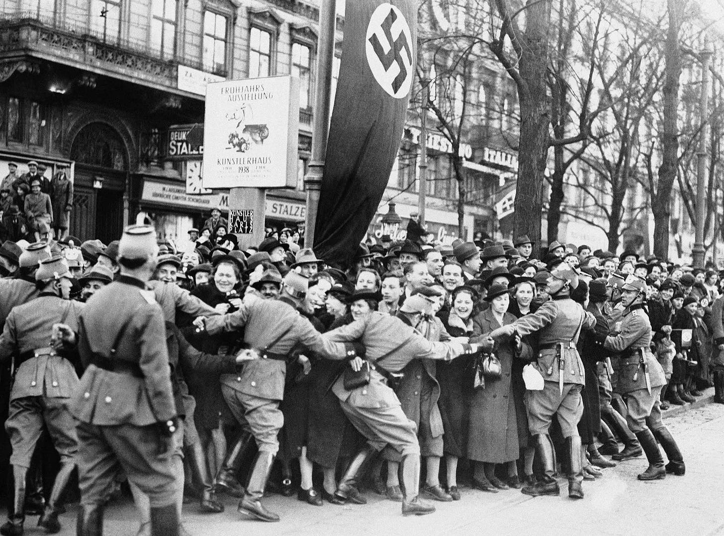 After the German annexation of Austria, police struggling to contain a cheering Austrian crowd during Adolf Hitler’s visit to Vienna. (March 1938)