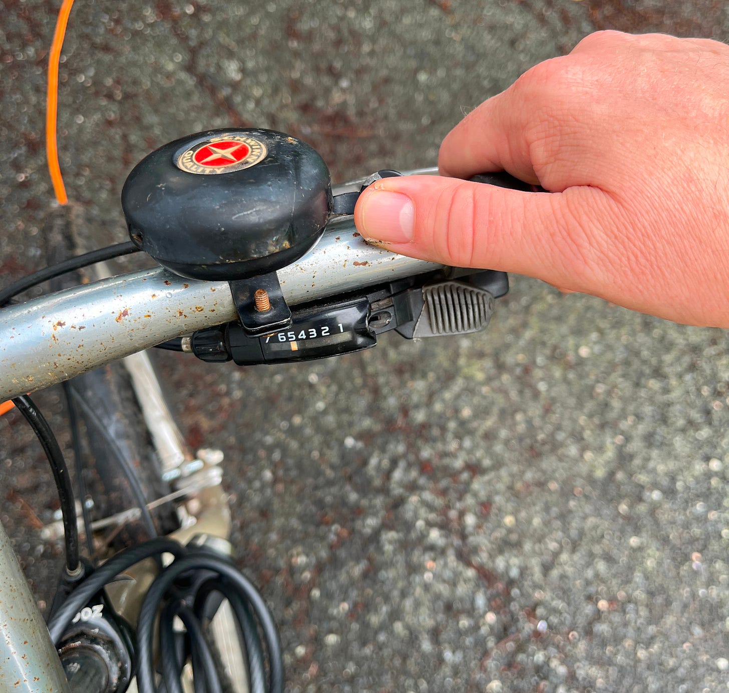 the handlebars of my bicycle with an old fashing bring-bring bell the handlebars of my bicycle with an old fashing bring-bring bell