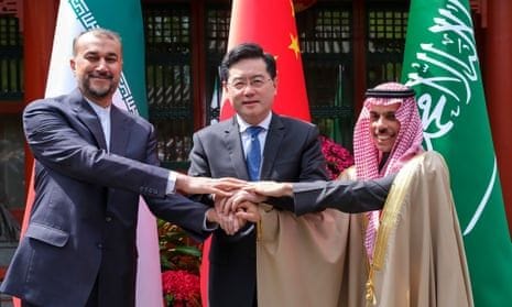 Iran's foreign minister, Amir-Abdollahian (left), holds hands with his Saudi Arabian and Chinese counterparts Prince Faisal bin Farhan and Qin Gang in Beijing. Iran's foreign minister, Amir-Abdollahian (left), holds hands with his Saudi Arabian and Chinese counterparts Prince Faisal bin Farhan and Qin Gang in Beijing.