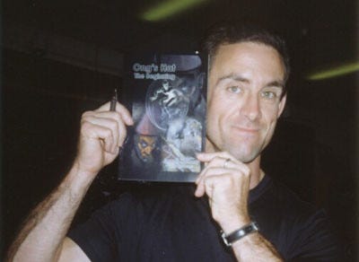 Chuck showing off my book when we traded signed copies of each other’s books. 