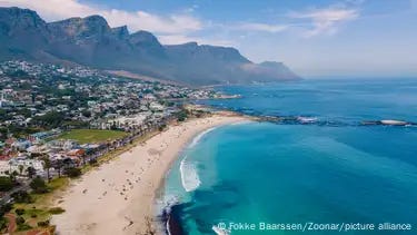 Aerial image of Camps Bay seafront in Cape Town with Twelve Apostles mountains in the back Aerial image of Camps Bay seafront in Cape Town with Twelve Apostles mountains in the back
