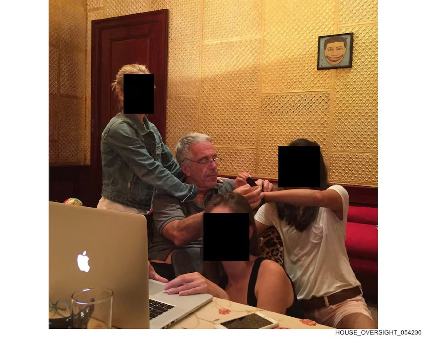 Late financier and convicted sex offender Jeffrey Epstein appears with women, whose identities have been obscured, in this image from the Epstein estate released by House Oversight Committee Democrats in Washington, D.C., U.S., on December 18, 2025. House Oversight Committee Democrats