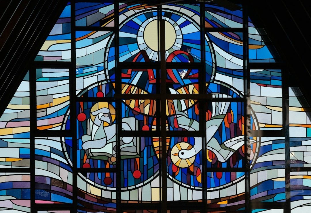 A large stained glass window in a church