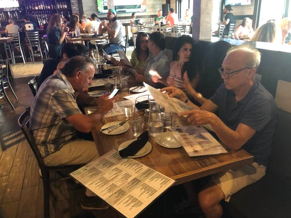 May be an image of 11 people, drink and table