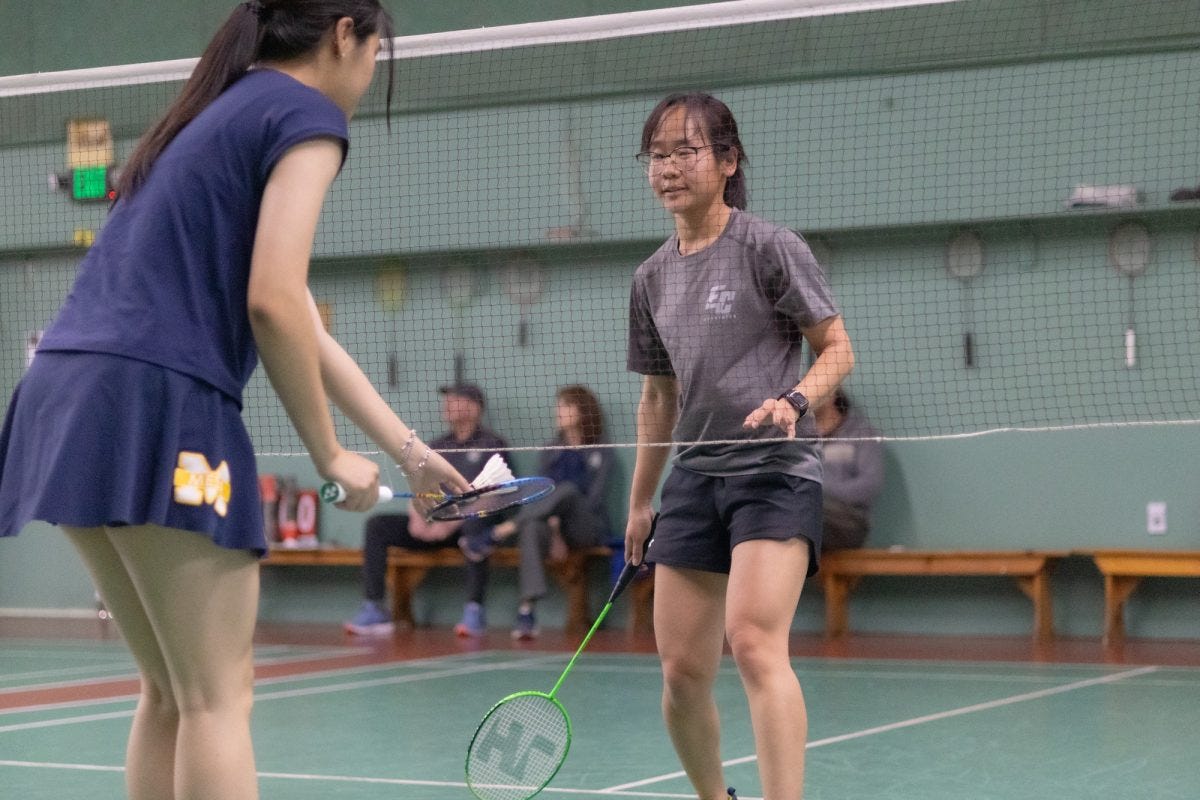 El Camino College Warrior Montila Winyaworapon (right) accepts a birdie from a San Diego Mesa Olympian at the Manhattan Beach Badminton Club on Friday, April 11. The Warriors were defeated by the Olympians 14-3. (Katie Gronenthal | The Union)