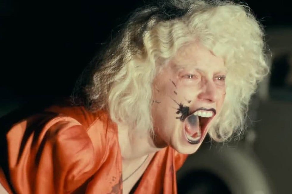 jessie buckley in the bride screaming in an orange dress jessie buckley in the bride screaming in an orange dress