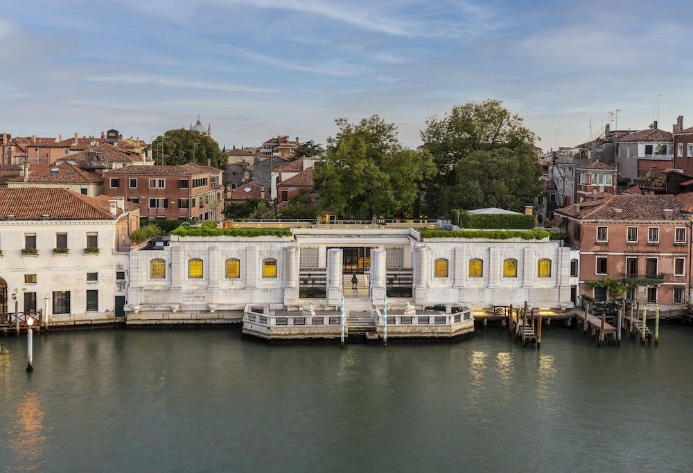 A a white palazzo facing the canal's of Venice.