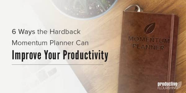 The Momentum Planner on a wooden desk. Text overlay: 6 Ways the Hardback Momentum Planner Can Improve Your Productivity The Momentum Planner on a wooden desk. Text overlay: 6 Ways the Hardback Momentum Planner Can Improve Your Productivity