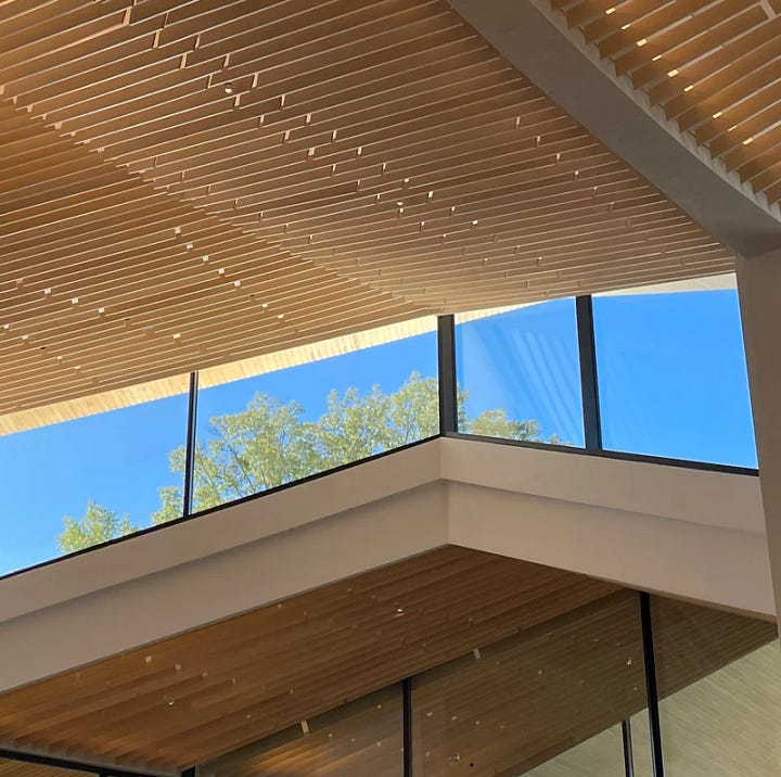 An elegant, open stairwell and upper windows.