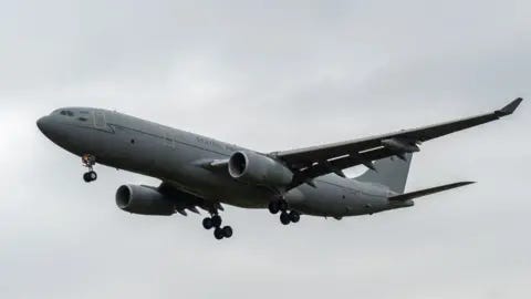 NurPhoto via Getty Images A grey RAF Voyager seen flying through cloudy skies NurPhoto via Getty Images A grey RAF Voyager seen flying through cloudy skies