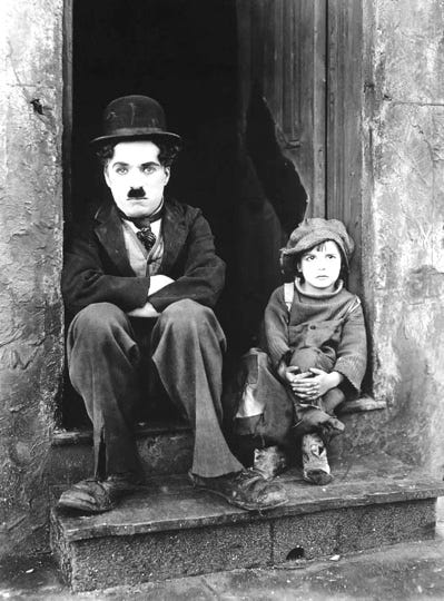 A person and child sitting in a window

Description automatically generated with medium confidence