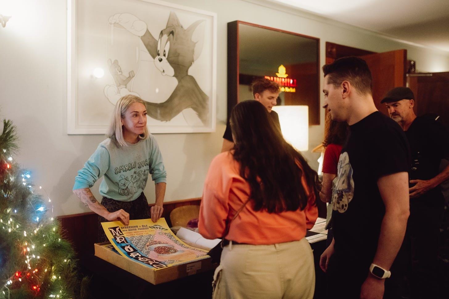 Jess Johnson with a Mister Organ poster she had designed