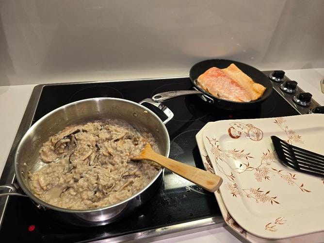 A pan with food on a stove

AI-generated content may be incorrect.