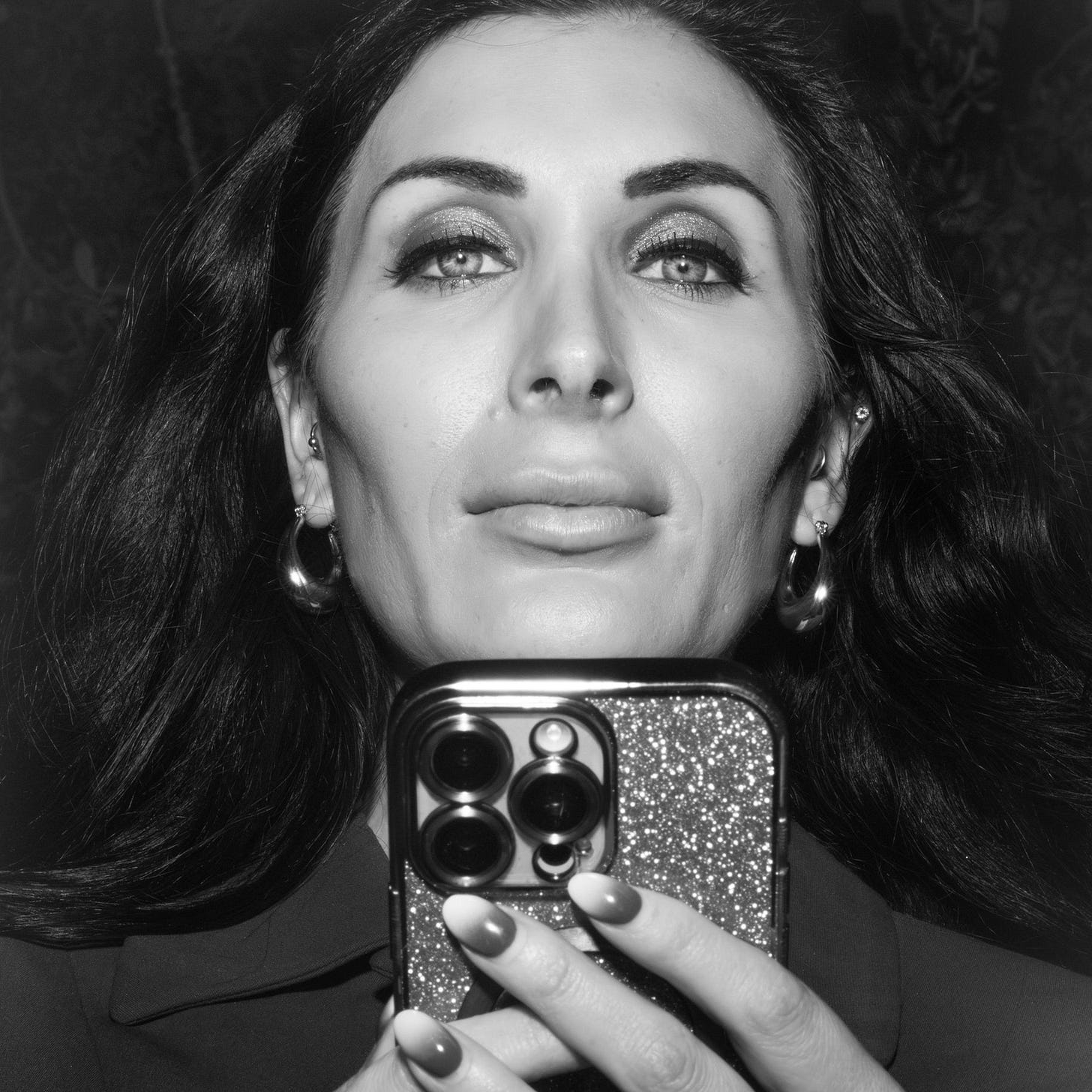 A woman holding a smartphone