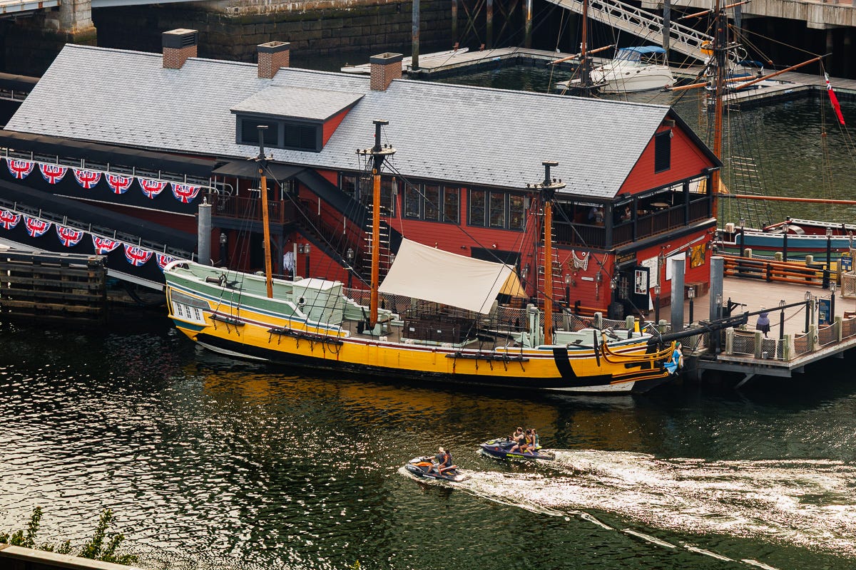 Boston Tea Party Boats withLights turned on at dusk from a balcony on 14th Floor