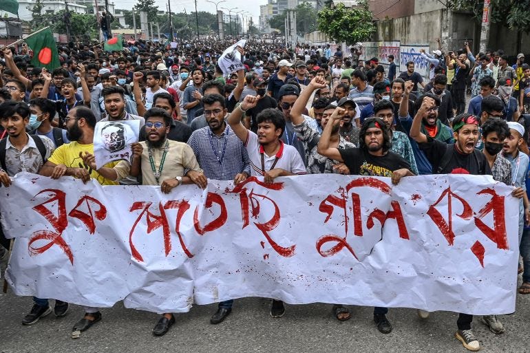 Students shout slogans during a protest march