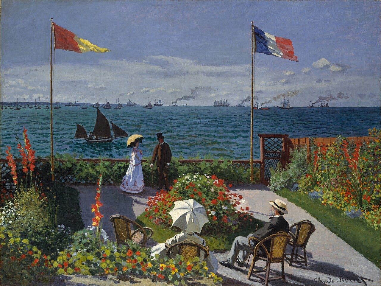 A flowered seaside terrace above a sea of sailboats A flowered seaside terrace above a sea of sailboats