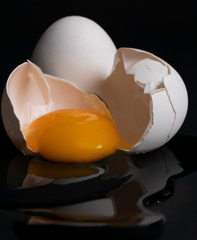 white egg on brown wooden tray white egg on brown wooden tray