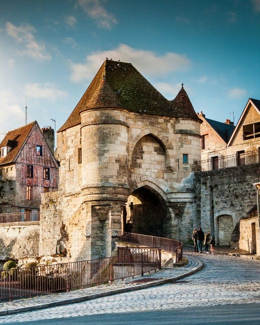 May be an image of 3 people and castle