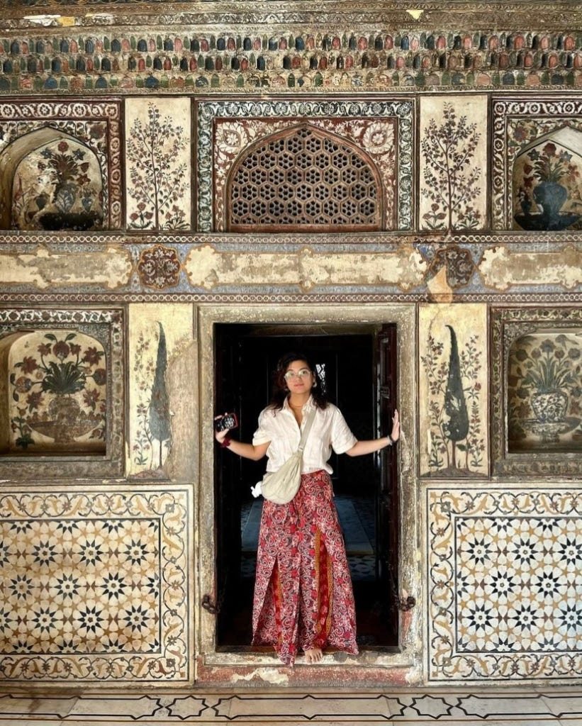 Maria Mison, a Filipina shaman, standing in an ornately decorated doorway. Maria Mison, a Filipina shaman, standing in an ornately decorated doorway.