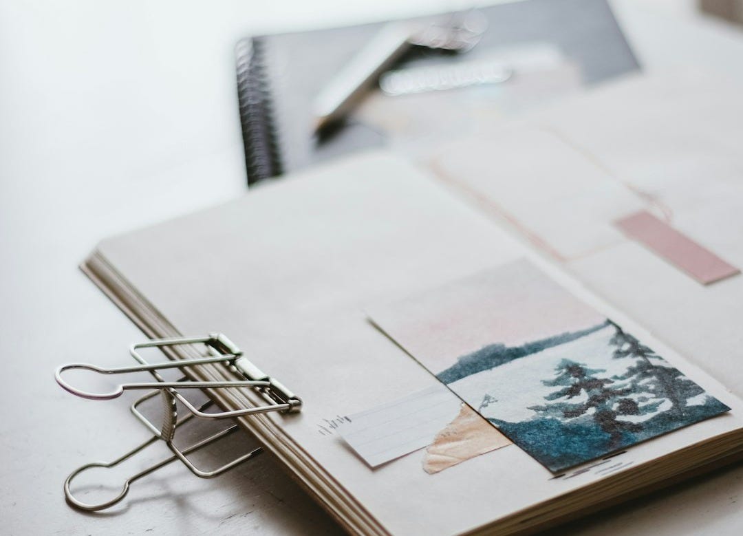 white printer paper with black framed eyeglasses