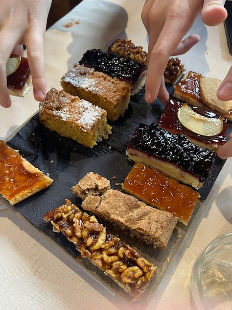 Top L to R: starting at piazza San Martino in Lemna, frost on the trail up, hiking and friends, antipasti e vino, stinco secondo, Coco licking the remains of my pizzocheri plate, homemade cakes for dolce, and the walk down at sunset,