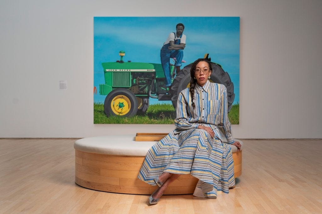 Amy Sherald with her painting 
