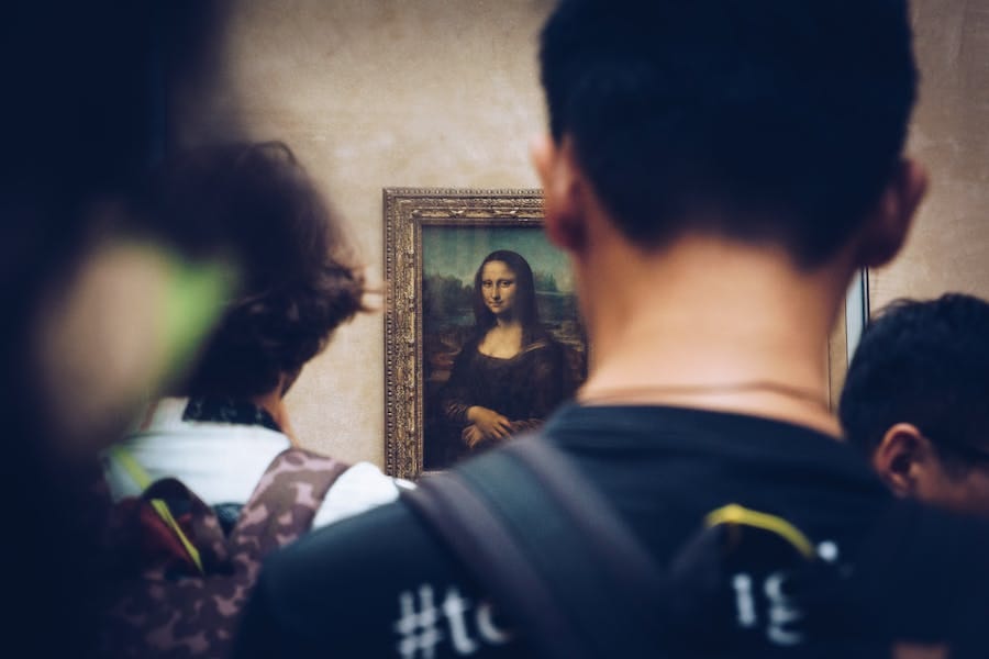 The Mona Lisa painting in the Louvre Museum is known to attract the masses. Photo by Juan Di Nella