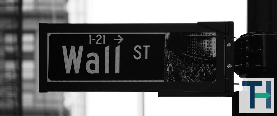 grayscale photo of Wall St. signage
