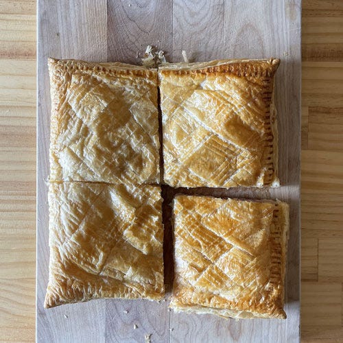 Ham and cheese pie being eaten.