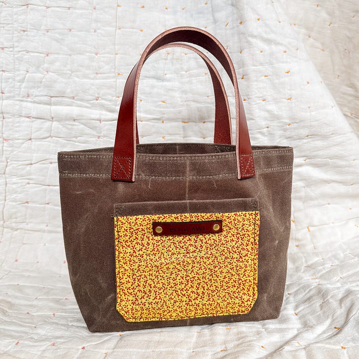 waxed canvas tote with vegetable tanned leather and antique textiles