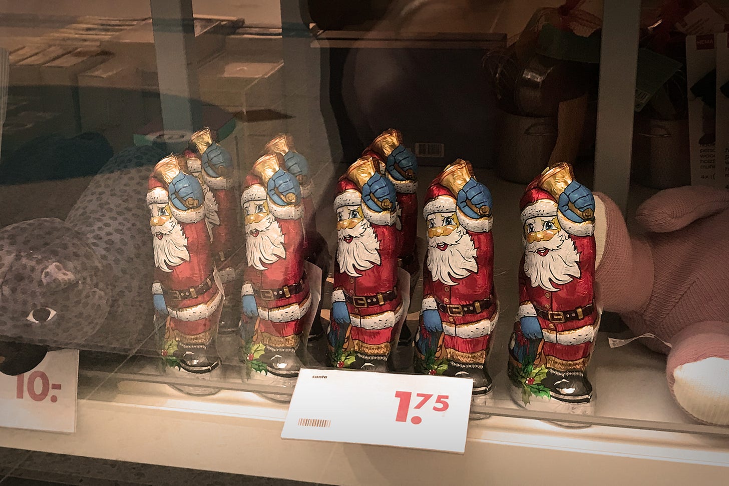 Photograph of Chocolate Santas in a shop window, March 2021