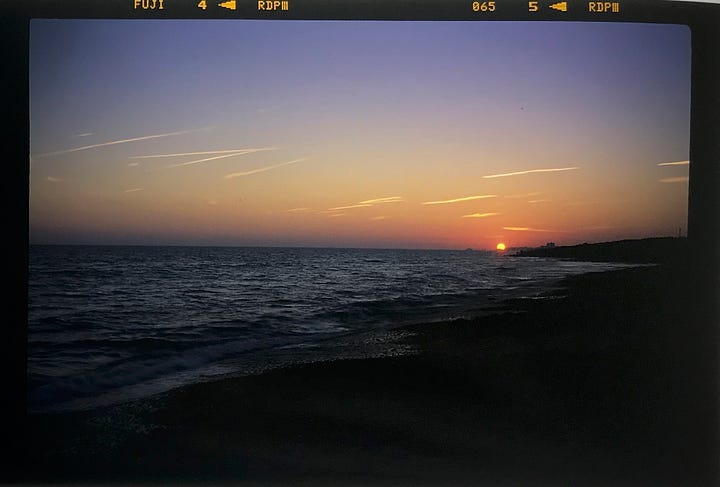 Sunset seen through a film camera rangefinder, and the resulting image on transparency film.