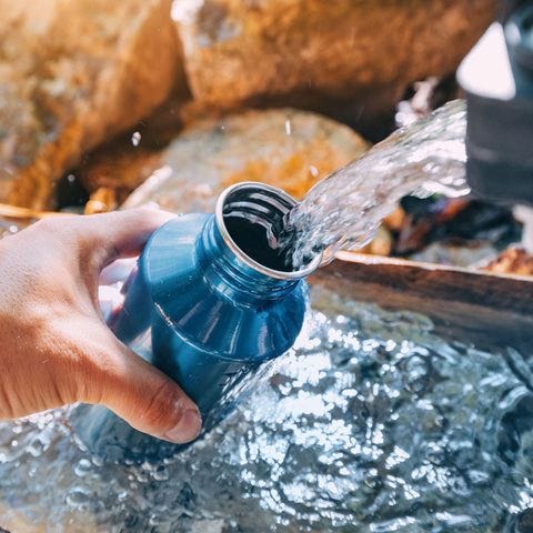 Water flowing into a water bottle