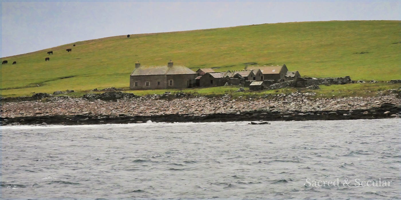 Abandoned stone buildings on the grassy island of Swona, with a rocky shoreline and sea in the foreground and cattle grazing on the hillside. Abandoned stone buildings on the grassy island of Swona, with a rocky shoreline and sea in the foreground and cattle grazing on the hillside.