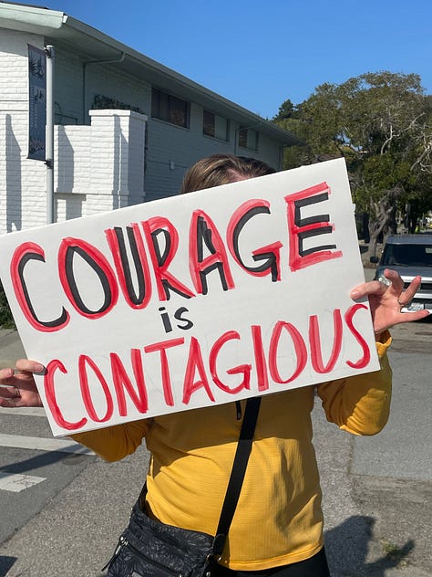 Protestors holding signs