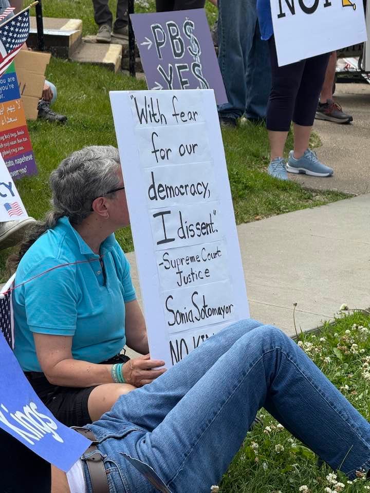 May be an image of 2 people and text