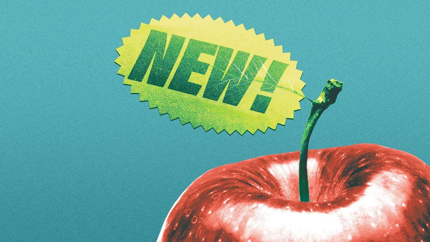 Illustration of an apple with a sticker reading NEW! instead of a leaf. 