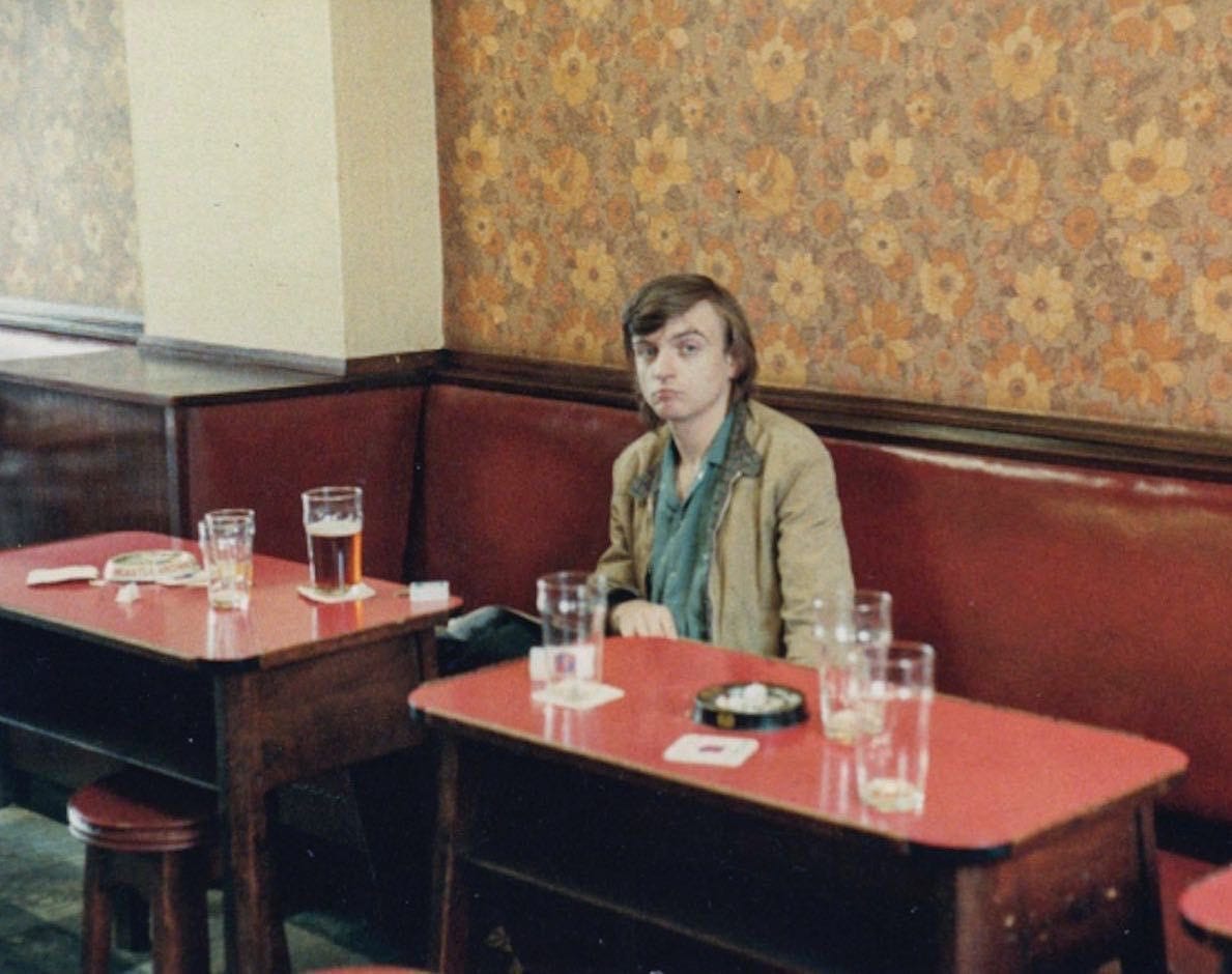 Mark E Smith at The Forresters in Prestwich, Manchester, by Charles Gordon Montgomery, early 1980s. Mark E Smith at The Forresters in Prestwich, Manchester, by Charles Gordon Montgomery, early 1980s.