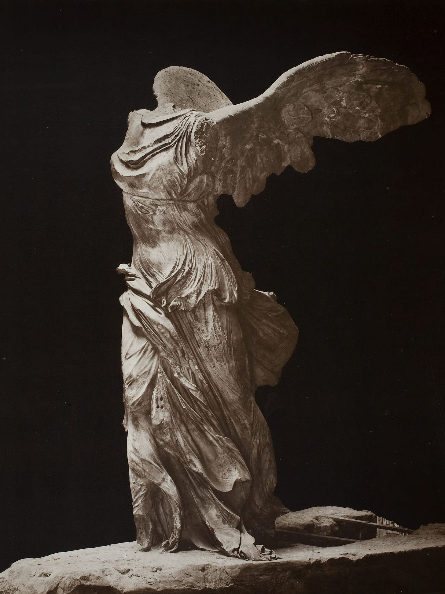Image may contain Person Art Angel and Kneeling