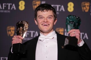 Robert Aramayo poses with the EE rising star award and the award for leading actor for 'I Swear' at the 79th British Academy Film Awards, BAFTA's, in London, Sunday, Feb. 22, 2026. (AP Photo/Alastair Grant)