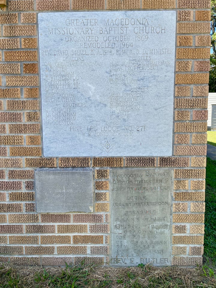Photos of carved stone markers near the front door of the church.