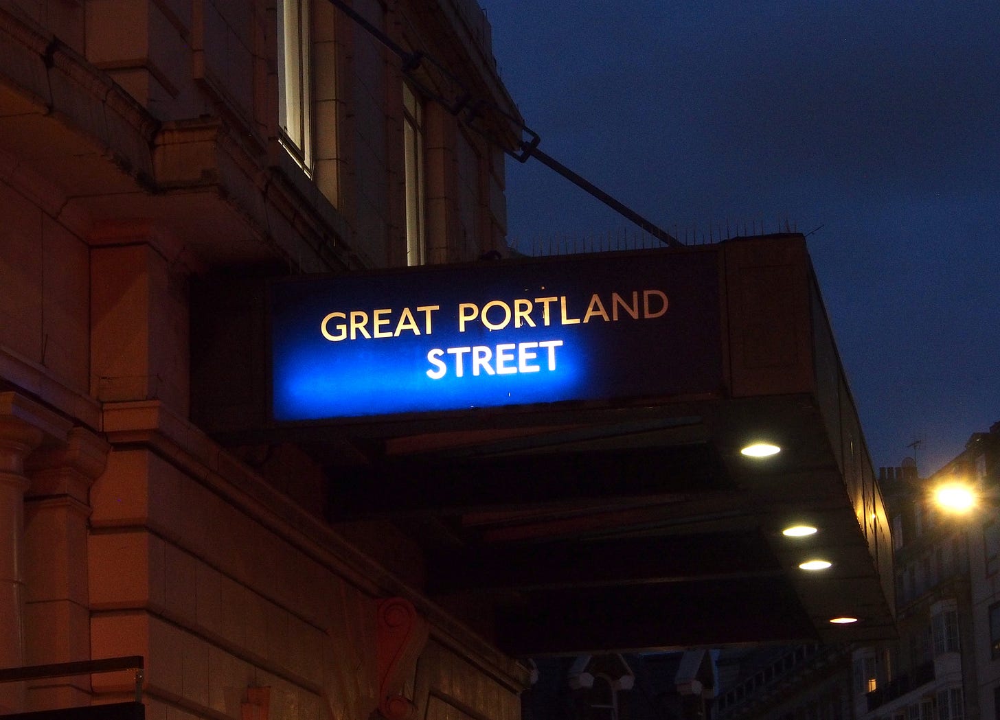 Night-time view of sign at Great Portland Street station.