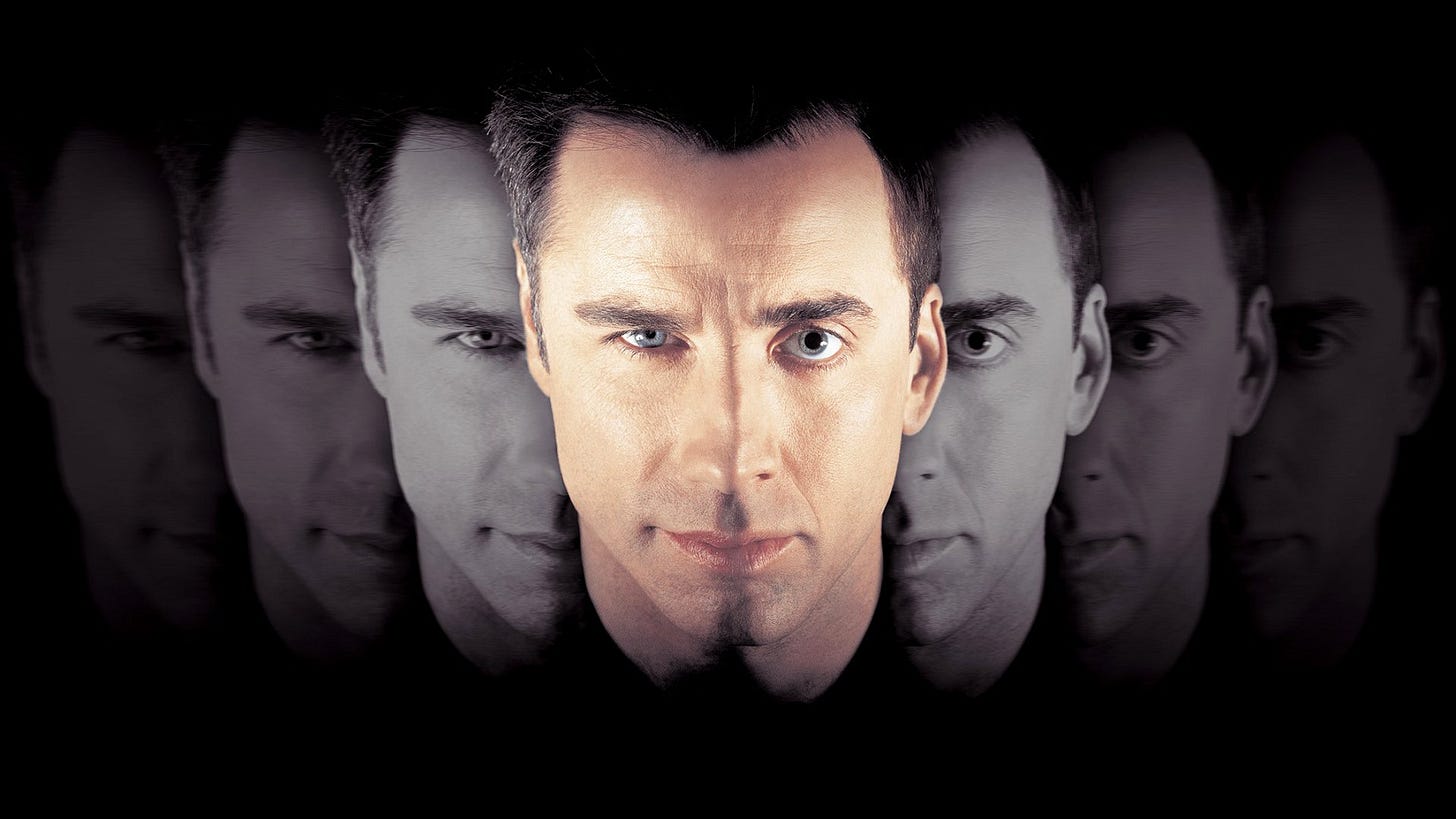 Image of John Travolta's and Nic Cage's faces merging, from the poster for the movie 'Face Off' Image of John Travolta's and Nic Cage's faces merging, from the poster for the movie 'Face Off'