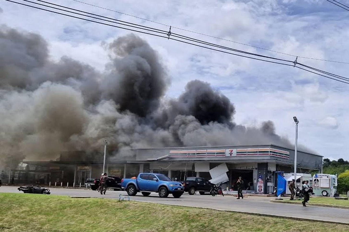 A BM21 rocket fired from Cambodia strikes a convenience store at a PTT petrol station in Ban Phue, Kantharalak district, Si Sa Ket, sparking a fire that killed eight people and injured 13 others on Thursday. The strike occurred as a school vehicle stopped for snacks en route to a bunker. The site is about 20km from the Thai–Cambodian border. (Photo: Kantharalak police station) A BM21 rocket fired from Cambodia strikes a convenience store at a PTT petrol station in Ban Phue, Kantharalak district, Si Sa Ket, sparking a fire that killed eight people and injured 13 others on Thursday. The strike occurred as a school vehicle stopped for snacks en route to a bunker. The site is about 20km from the Thai–Cambodian border. (Photo: Kantharalak police station)