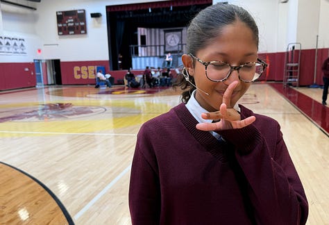 A young actress tries to stop smiling to portray the gloomy Wednesday Addams in the musical "The Addams Family."