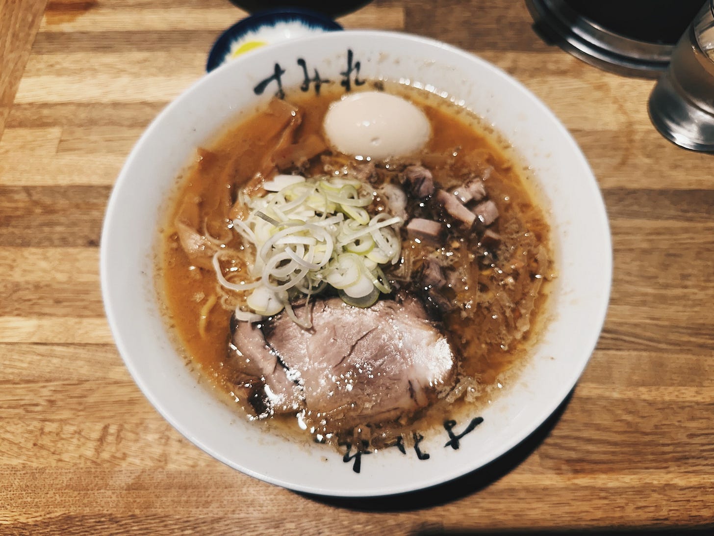 Miso ramen bowl with chashu, soft-boiled egg, and scallions at Sumire in Susukino, Sapporo, the birthplace of miso ramen. Miso ramen bowl with chashu, soft-boiled egg, and scallions at Sumire in Susukino, Sapporo, the birthplace of miso ramen.
