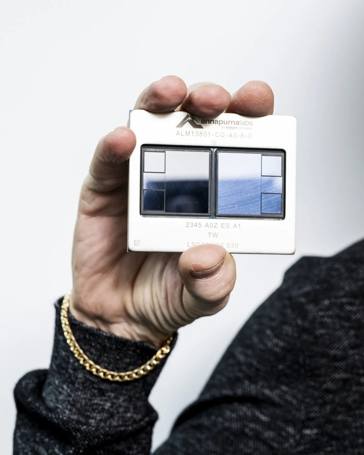 James Hamilton holding the Trainium2 chip.
