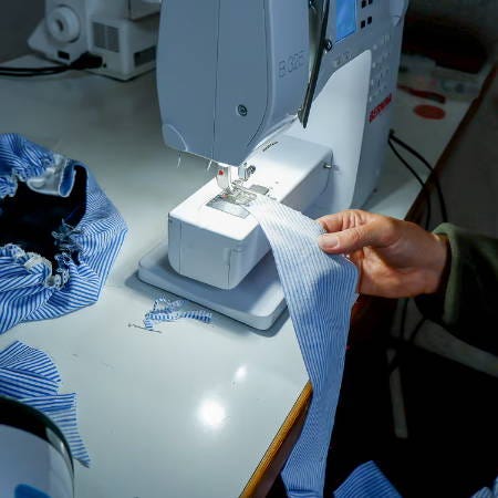 sewing the edges of the strip with a sewing machine sewing the edges of the strip with a sewing machine