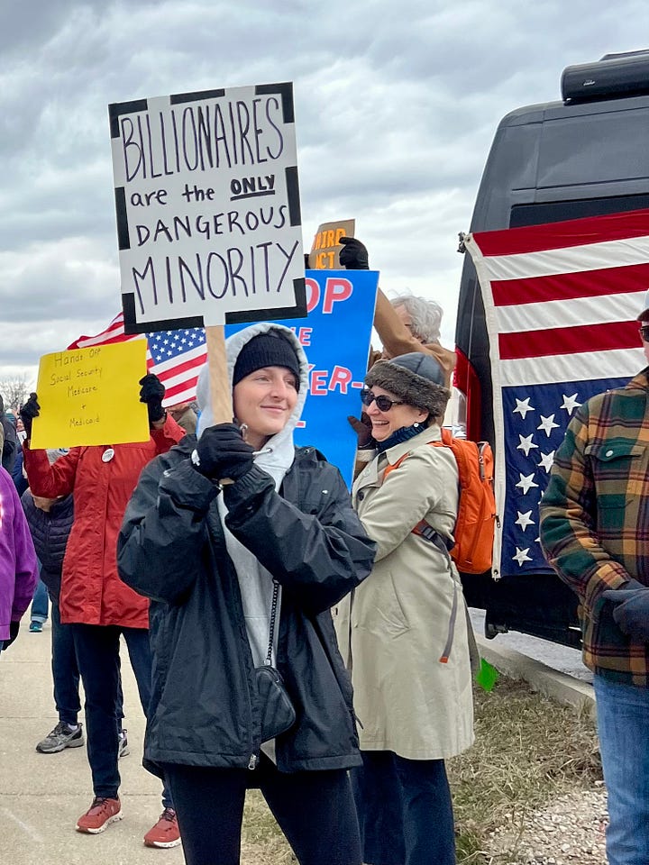 From top left - someone holds a sign saying "Billionaires are the only dangerous minority" in front of a truck with an upside down US flag; a large crowd carrying signs fills the lawn in front of a government building; a large group of people holding signs line a sidewalk; a large group of people with signs gather in a park, in the foreground is a sign that reads "Love is greater than fear" and an American flag.